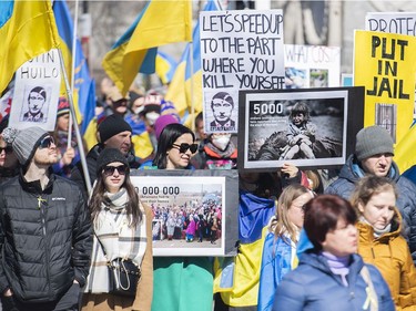 People take part in a rally in support of Ukraine in Montreal on Saturday, April 2, 2022.