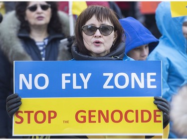 People take part in a rally in support of Ukraine in Montreal on Saturday, April 2, 2022.