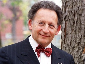 Boris Brott stands next to a tree