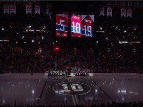 Guy Lafleur's #10 is shown on the big screen during a ceremony at the Bell Centre prior to an NHL hockey game between the Montreal Canadiens and Boston Bruins in Montreal, Sunday, April 24, 2022. Lafleur passed away on April 22 at the age of 70.