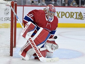 Canadiens goalie Carey Price makes a save during third period of Friday night’s game at the Bell Centre against the New York Islanders.
