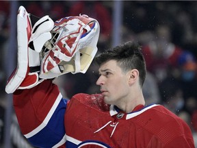 Apr 15, 2022; Montreal, Quebec, CAN; Montreal Canadiens goalie Carey Price (31) puts his mask on before the game against the New York Islanders at the Bell Centre. Mandatory Credit: Eric Bolte-USA TODAY Sports