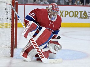 Montreal Canadiens goalie Carey Price makes a save during the third period against the New York Islanders at the Bell Centre in Montreal on April 15, 2022.