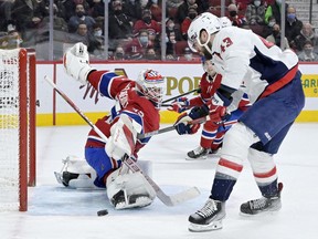 Canadiens goalie Sam Montembeault makes a pad save against Washington Capitals' Tom Wilson (43) at the Bell Centre on Saturday, April 16, 2022, in Montreal.