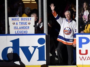 FILE - Hockey Hall of Famer and former New York Islander Mike Bossy waves to fans as he is introduced before the NHL hockey game between the Islanders and the Boston Bruins at Nassau Coliseum on Thursday, Jan. 29, 2015, in Uniondale, N.Y. Bossy dropped a ceremonial first puck.