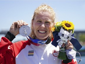 Laurence Vincent-Lapointe, of Canada, reacts while wearing her silver medal after competing in the canoe sprint women's C-1 200m at the 2020 Summer Olympics, Thursday, Aug. 5, 2021, in Tokyo.