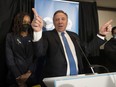 Premier François Legault celebrates with CAQ candidate Shirley Dorismond after Monday's win in the Marie-Victorin riding in Longueuil.