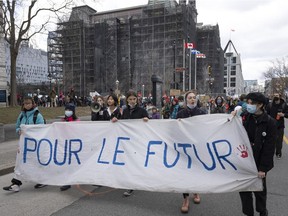 People mark Earth Day with a march, Friday, April 22, 2022  in Montreal.