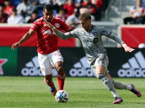 CF Montréal's Djordje Mihailovic (8) and New York Red Bulls midfielder Cristian Casseres Jr. (23) battle for the ball at Red Bull Arena on Saturday,  April 9, 2022, in Harrison, N.J.
