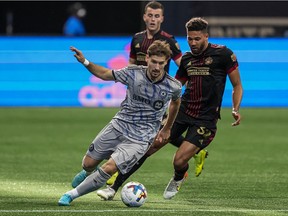 "It's crucial to win at home — and that's what we intend to do in the new few weeks," says CF Montréal midfielder Matko Miljevic, controlling the ball in front of Atlanta United defender George Campbell during the second half at Mercedes-Benz Stadium in Atlanta on March 19, 2022.