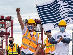Striking workers at the Port of Montreal express their anger on April 29, 2021, over the adoption by the federal government of legislation forcing them back to work.