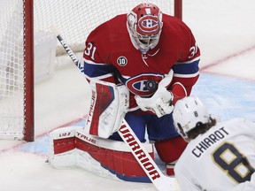 Carey Price of the Montreal Canadiens makes a save off on Ben Chiarot of the Florida Panthers in the second period at the Bell Centre in Montreal on April 29, 2022.