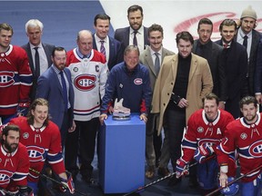 Long-time Canadiens equipment manager Pierre Gervais (centre with blue windbreaker) is honoured at centre ice by the whole team, including Captain Shea Weber (behind Gervais with a beard), before his, and the team's last game of the season against the Florida Panthers at the Bell Centre in Montreal on Friday, April 29, 2022.