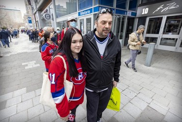 Torontonian John Catenacci and daughter Maya line up to get into the Guy Lafleur public visitation at the Bell Centre in Montreal on Monday, May 2, 2022.
