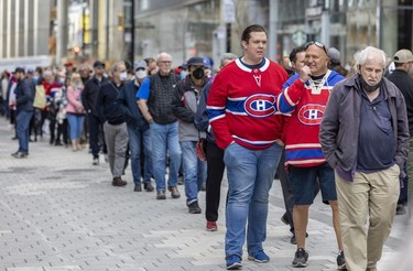 Hockey fans line up for the Guy Lafleur public visitation at the Bell Centre in Montreal Sunday, May 1, 2022.