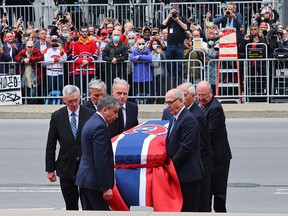 Pallbearers carry Guy Lafleur’s body into Mary, Queen of the World Cathedral for his funeral in Montreal on May 3, 2022.