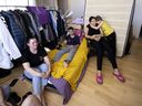With their bed leaning against the wall for the moment, nine-year-old Sofia Ladnitska hugs her mother, Tatiana Ladnitska. Their family — including Evgeniia Pimenova, left, and her son Yaroslav Vakhitov — fled Ukraine after the Russian military invasion began and is being hosted in the West Island by Tatiana and Daniel Romano.