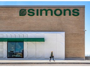 A shopper leaves the new Simons store at Fairview Pointe-Claire.