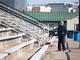 A Saskatchewan Roughriders fan shows up to watch the first day of the team's training camp in Saskatoon on Sunday, May 15, 2022, only to find out it is cancelled because of a player strike.