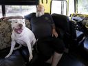 Guylain Levasseur, 56, and the dog Misha are sitting in the living room of their motorhome.  “People cannot bear to see suffering,