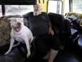 Guylain Levasseur, 56, and dog Misha sit in the lounge area of his motorhome. “People can’t stand to see suffering," says Levasseur, who has long worked with marginalized youths in Montreal's east end. "But it exists, you can’t just wish it away."