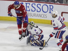 Cédric Paquette of the Laval Rocket screens goalie Aaron Dell of the Rochester Americans in Game One of the AHL North Division final playoff series at Place Bell in Laval on Sunday, May 22, 2022.