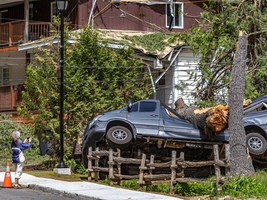 Marc-André Ouellet's Mercedes vehicle was the centre of everyone's photos after the storm smashed his camper van in his driveway in Morin-Heights on Tuesday May 24, 2022.