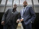 Joel DeBellefeuille, left, founder of anti-racism group Red Coalition and Alain Babineau who is beginning his new role as director on issues of racial profiling and public safety on Tuesday in front of Palais de Justice.