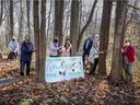 Save the Fairview Forest members gather in the wooded area west of the Fairview Pointe-Claire shopping center in 2020.