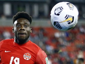 Canada's forward Alphonso Davies chases the ball during a 2022 World Cup qualifying match last fall.