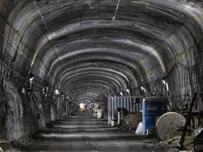 The original $7-billion REM line has run into delays and cost overruns. Above: tunnel work at Édouard-Montpetit station.