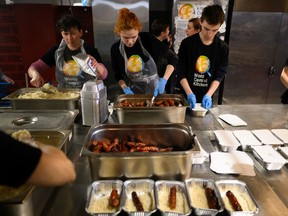 Chefs and volunteers at World Central Kitchen prepare and package warm meals to be distributed to those in need across the city on April 22, 2022 in Lviv, Ukraine. Beyond refugees arriving in the city, the meals are also provided to workers and volunteers who are helping to keep the city moving.