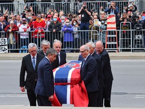 Pallbearers carry Guy Lafleur's body into Mary Queen of the World Cathedral for his funeral in Montreal Tuesday May 3, 2022.