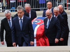 Pallbearers carry Guy Lafleur's body into Mary Queen of the World Cathedral for his funeral in Montreal Tuesday May 3, 2022.