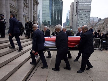 Pallbearers carry Guy Lafleur's body into Mary Queen of the World Cathedral for his funeral in Montreal Tuesday May 3, 2022.