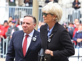 François Legault and wife Isabelle Brais arrive for Guy Lafleur's funeral.