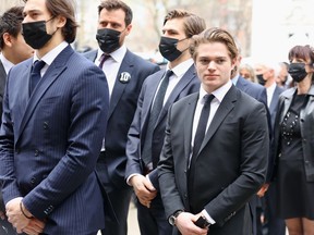 Montreal Canadiens players Cole Caufield, right, and Shea Weber, third from right, arrive at Guy Lafleur's funeral.