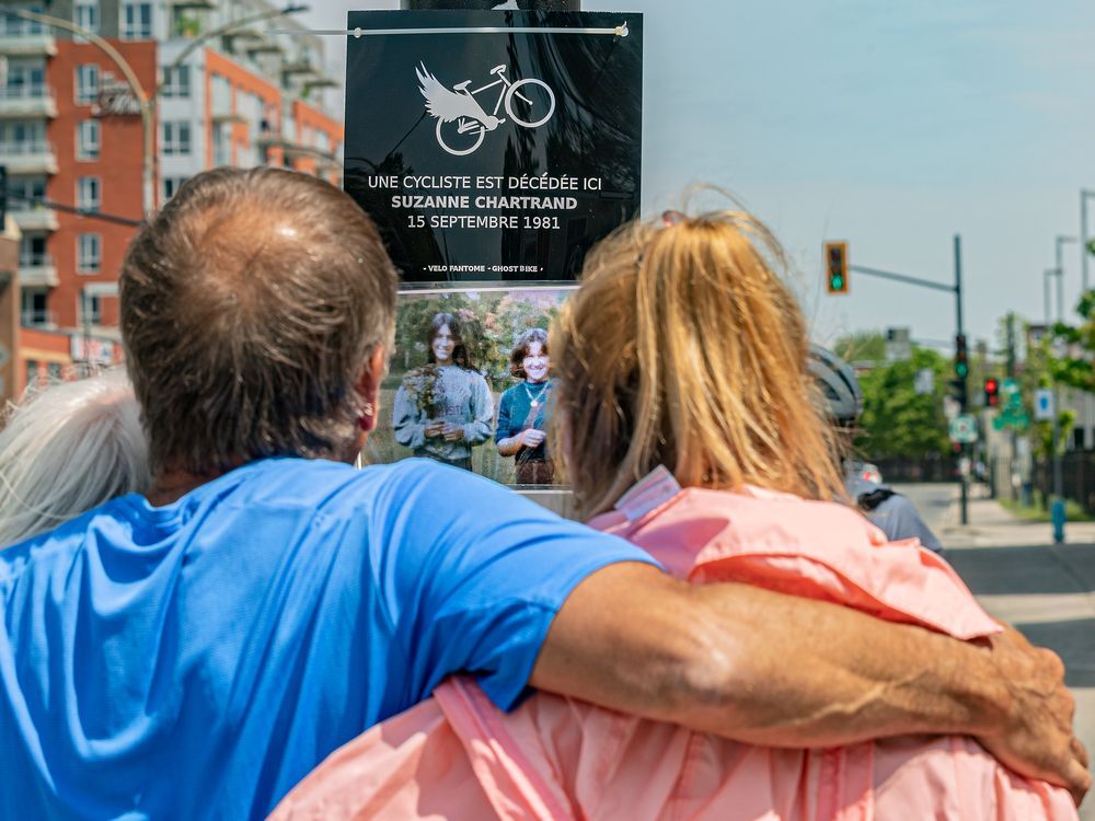 Cyclist Suzanne Chartrand, who was killed on Sept. 15, 1981, was commemorated with a plaque at the corner of Henri-Bourassa Blvd. and Berri St. in Montreal on Sunday, May 22, 2022. Today would have marked her 61st birthday. Former boyfriend Maurice Bergeron of Suzanne Chartrand  and her sister, Hélène Chartrand, look over the plaque. 