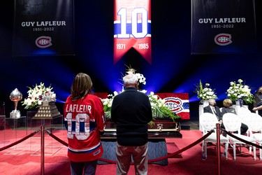 Montreal Canadiens fans pay tribute during the visitation for Guy Lafleur at the Bell Centre on May 1, 2022.