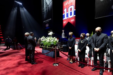 Quebec Premier Francois Legault and his wife, Isabelle Brais, attend the visitation for Guy Lafleur at Montreal's Bell Centre on May 1, 2022