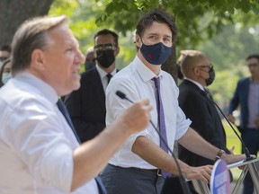 Responsibility for immigration is shared between the two governments "because the protection of French and francophone immigration are very important to us," Prime Minister Justin Trudeau said Tuesday. He is seen with Quebec Premier François Legault, right, during a child-care funding announcement in Montreal on Thursday, Aug. 5, 2021.