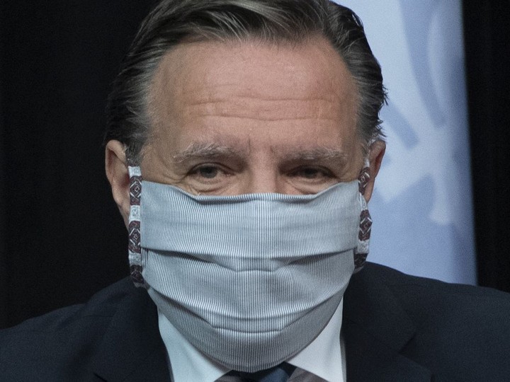  Premier François Legault arrives at a news conference on the COVID-19 pandemic wearing a mask, Tuesday, May 12, 2020 at the legislature in Quebec City.