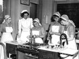 Student nursing aides make eggnog on May 9, 1951. They are identified, from left, as student Violet Evans; dietician Margaret Fasken, who was supervising; and students Jean Buchanan, Frances Burgess and Helen Ford.