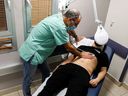 A patient suffering from long-term COVID is examined at the post-coronavirus disease (COVID-19) clinic at Ichilov Hospital in Tel Aviv, Israel, on February 21, 2022.