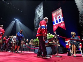 Fans offer their condolences to Lise Lafleur, wife of the Montreal Canadiens great, during visitation at the Bell Centre on May 1, 2022.