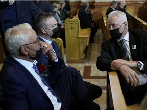 Former Montreal Canadiens, from left, Mario Tremblay, Patrick Roy and Larry Robinson attend the funeral services for Canadiens legend Guy Lafleur at Mary, Queen of the World Cathedral in Montreal on May 3, 2022.