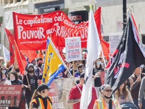 People attend a May 1 rally in Montreal, Sunday, May 1, 2022.