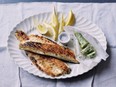 Darina Allen serves pan-grilled fish alongside butter flavoured with lemon juice and parsley.