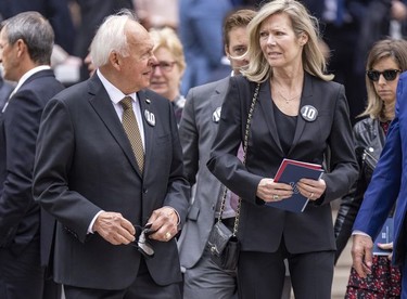Former Montreal Canadiens captain Yvan Cournoyer and his wife Evelyn arrive for the funeral for Guy Lafleur at Mary Queen of the World Cathedral in Montreal Tuesday, May 3, 2022.