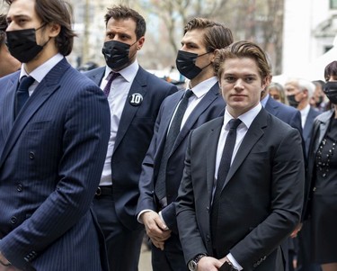 Montreal Canadiens players including Alexander Romanov, left, captain Shea Weber, second from left, and Cole Caufield, right, arrive for the funeral for Guy Lafleur at Mary Queen of the World Cathedral in Montreal Monday May 2, 2022.
